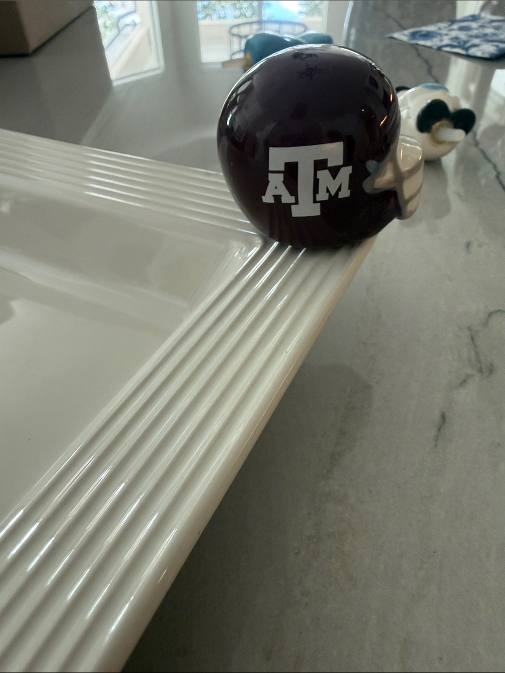 Nora Fleming Aggie helmet